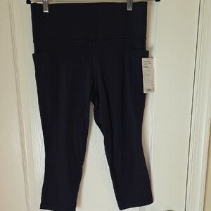 Athleta Navy Salutation Stash Pocket II Capri Leggings